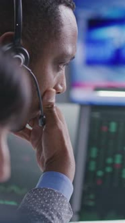 Multiethnic Financial Analysts Monitor Realtime Stocks on Computer