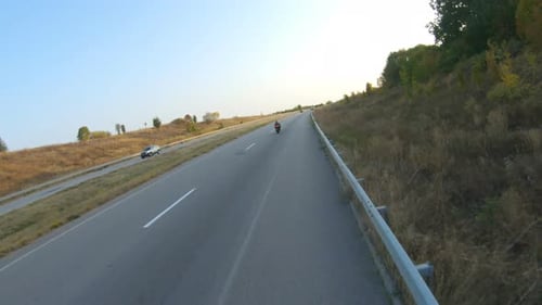 Aerial Shot of Motorcyclist Riding on Modern Sport Motorbike at Autumn Highway Biker Racing His