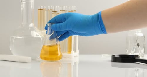 Laboratory Glassware Filled with Yellow and Green Liquid