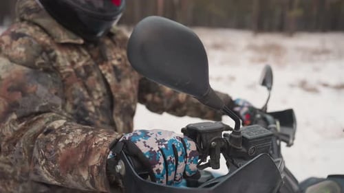 ATV Rider on Snowy Path, Winter Exploration