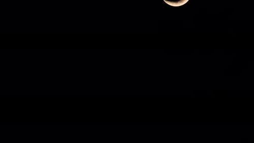Waxing Crescent Moon, 4K Time Lapse, going down from the top right corner of the frame as seen throu
