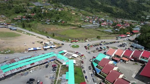 Aerial drone of a city Kundasang Sabah Malaysia lock track left back shot