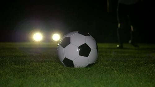 Soccer Player Athlete Training Foot Ball Sport on Soccer Field at Night