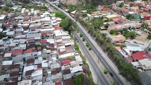 Aerial view of residential zones in Tegucigalpa, Honduras, divided by central highway