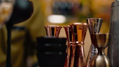 cocktail utensils jigger cocktail mixer strainer shaker on the bar concept of alcoholic beverages