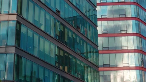 Futuristic Buildings with Panoramic Windows on Facades in City Environment