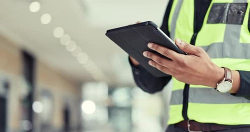 Engineering person, hands and tablet for construction planning, project management