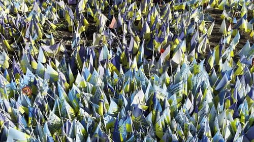 Many Small Flags of Ukraine with Names of the Dead War Against Russia Memorial of the Fallen