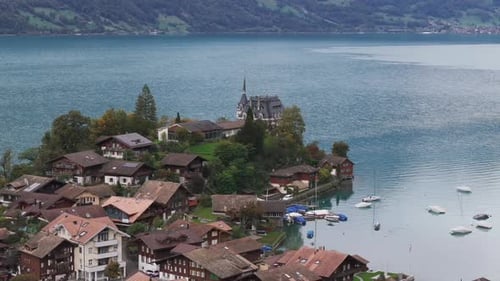 Aerial view of picturesque fishing village Iseltwald on Lake Brienz, Switzerland
