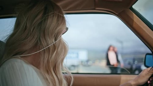 Woman Driving Car in City