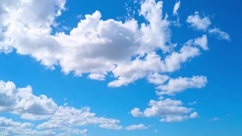 White Clouds Drifting Across a Blue Sky