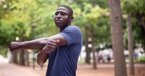 Nature, sports and black man stretching arms for exercise in outdoor park, field or garden