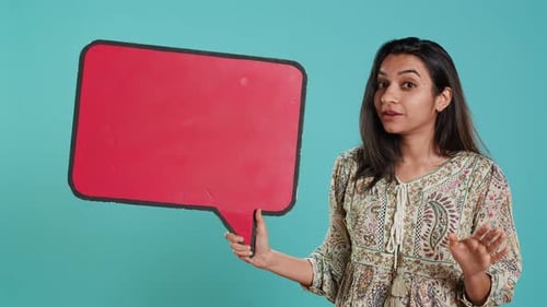 Woman Holding Red Speech Bubble Sign of Empty Copy Space for Message