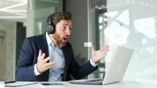 Excited Businessman Celebrates Success in Office