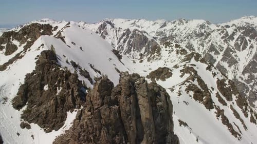 The Snowcapped Peaks and Sheer Cliffs of the Grand Teton Mountains In