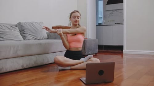 Woman Doing Yoga Stretching Routine at Home