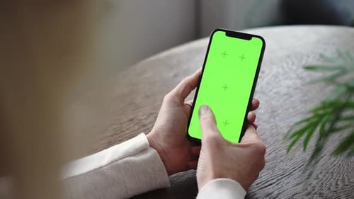 Mature Woman Hands with Smartphone Green Screen