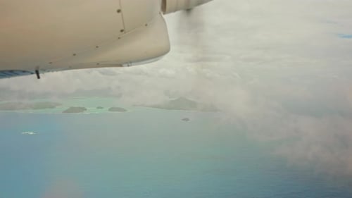 Charter engine from window view. Airplane propeller turbine flying through clouds. Jet engine soarin