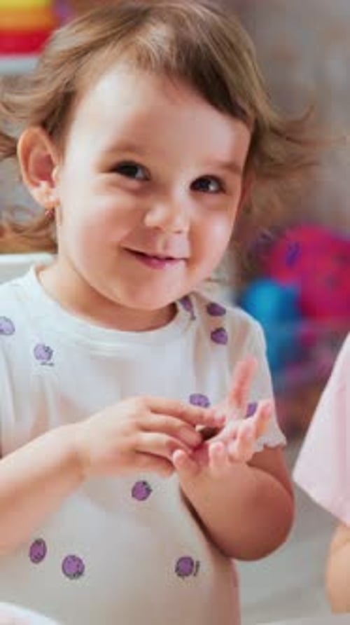 Adorable Child Plays with Playdough with Woman