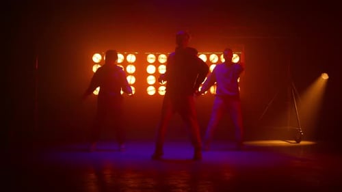 Sporty Dancers Team Showing Hiphop Moves on Night Club Stage. Dance Group