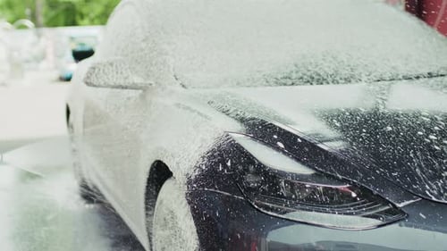 Washing Car with Foam at Outdoor Car Wash