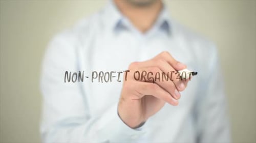 Non Profit Organization, Man Writing on Transparent Screen