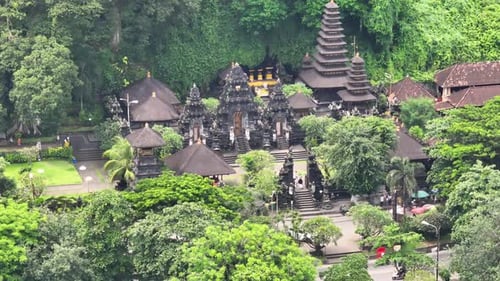 People coming to the sacred temple pray in Bali. Pura Goa Lawah, hinduism in Indonesia.