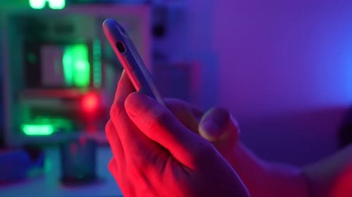 Closeup Side View of Unrecognizable Man Watching and Read News on Smartphone Scrolling Up and Down