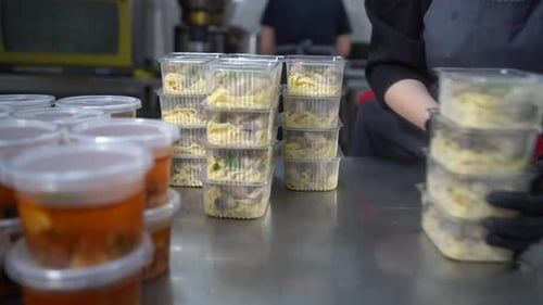 Efficiently packing prepared pasta meals for delivery or takeout service