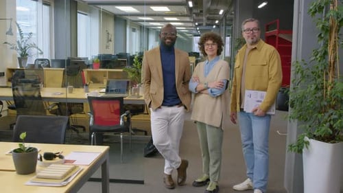 Cheerful Office Team Standing in Modern Open Space Office