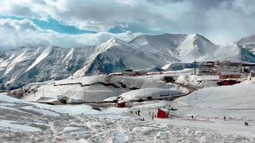 View of the ski slope against the backdrop of mountain peaks