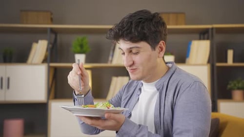 Eating green salad with pleasure.