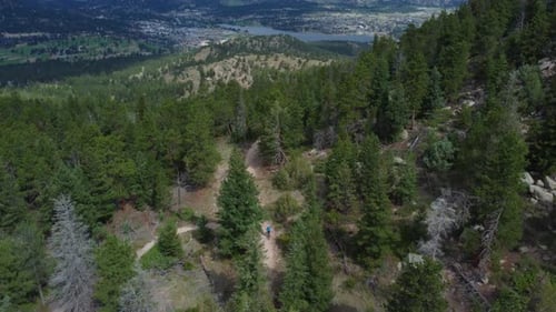 Aerial of mountain bikers traversing a high mountain trail in Colorado