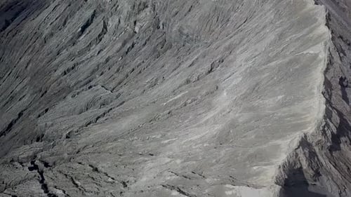 Baffling fly-over smoking crater of Bromo volcano in Java, Indonesia - Aerial wide fly-over 360 pano