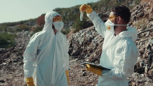 Scientists Inspecting Waste at a Landfill