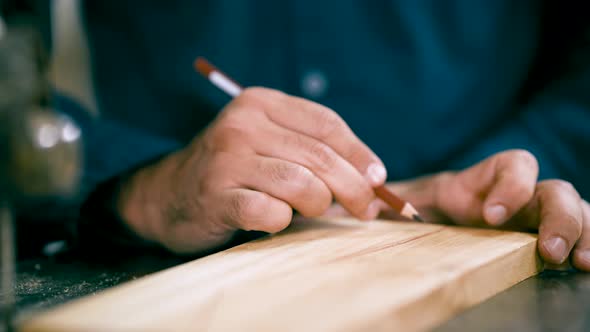 Carpenter's Hands Drawing a Line on Wood Plank, Industrial Stock ...