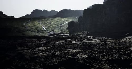 Stunning Rocky Landscape at Dusk with Flowing Water in a Serene Setting