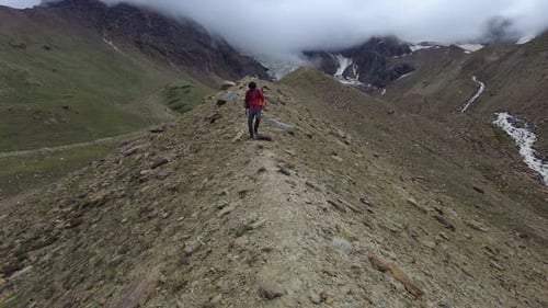 A Man Walking on the Narrow Rugged Path on Mountain in Himachal
