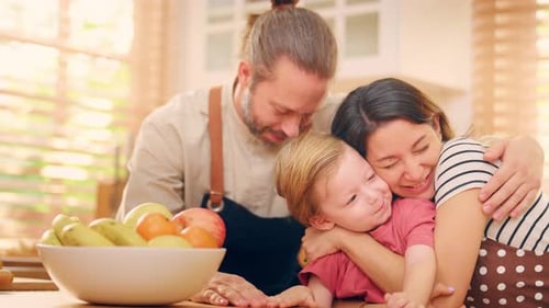 Caucasian attractive couple baking bakery with son in kitchen at home.
