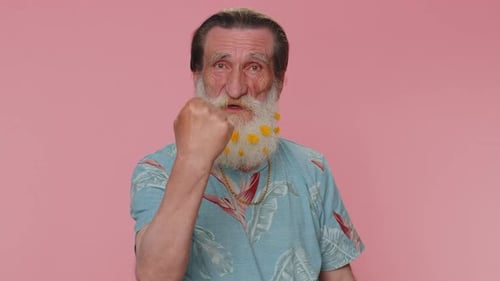 Elderly Man with Flowers in Beard Gesturing