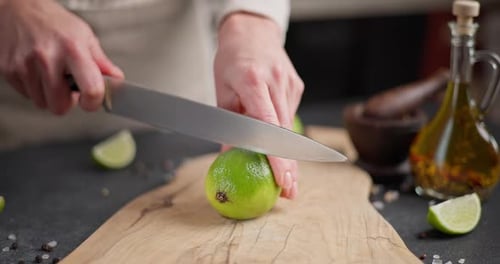 Cutting Fresh Lime on Wooden Cutting Board