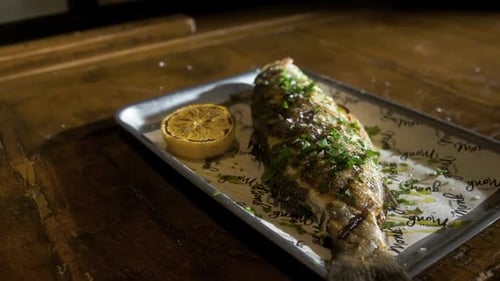Grilled Fish with Lemon on a Tray