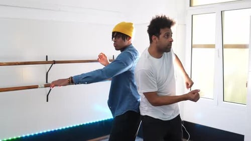 Energetic Afro Hip Hop Dancers Rehearsing Choreography in Dance Studio