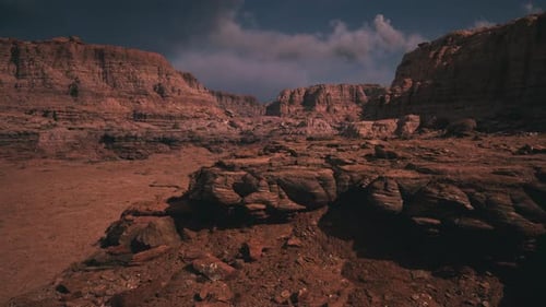 Vast Desert Canyon Landscape with Moving Clouds Time Lapse
