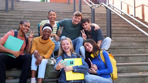 Diverse Group of University Students Taking a Selfie Together on Campus Stairs