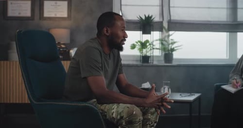 Man Talking to Therapist in Counseling Session