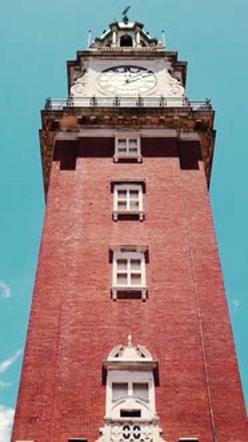 Vertical View Monumental English clock tower of Buenos Aires city Argentina, landmark building low a