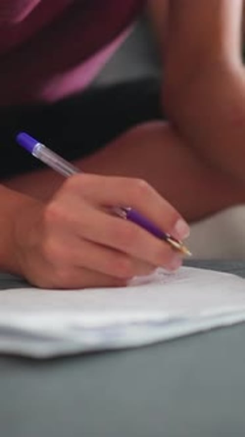 Hand Writes on Paper with Pen Close Up