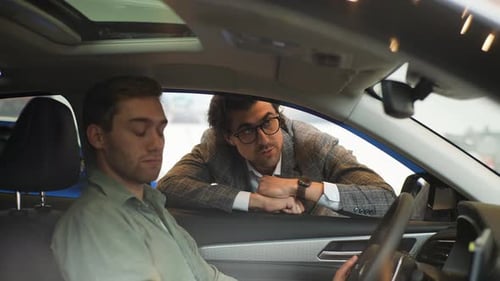 View Through the Side Window of the Car to Stylish Sales Manager Wearing Business Suit Talking to
