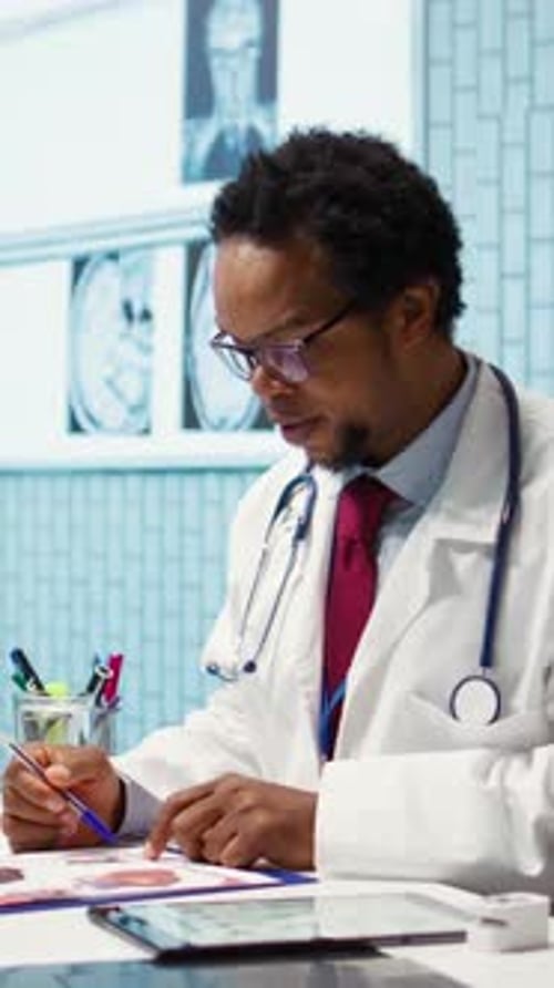 Vertical Video Male Physician Doing an x Ray Diagnostics Scan Interpretation During Check Up